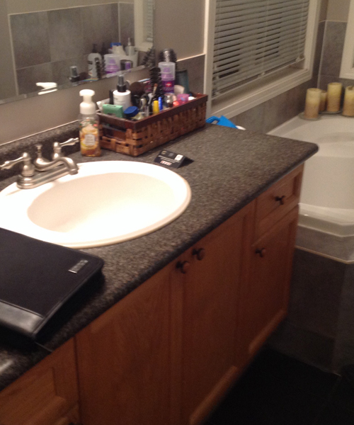 Before photo of a cluttered sink