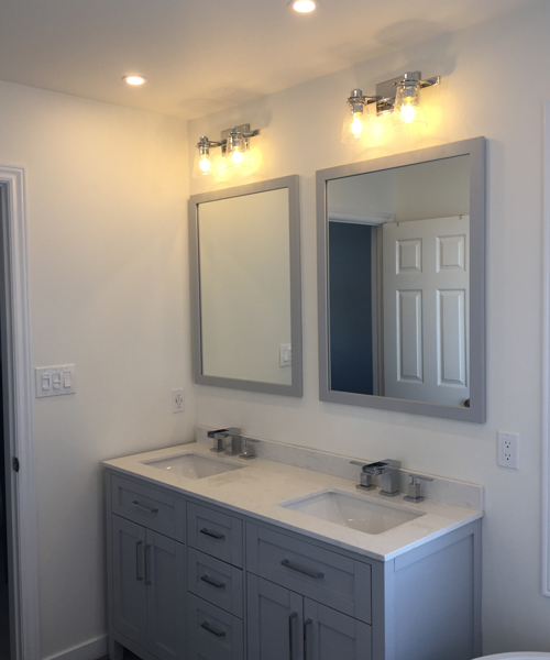 Bathroom with two sinks and two mirrors