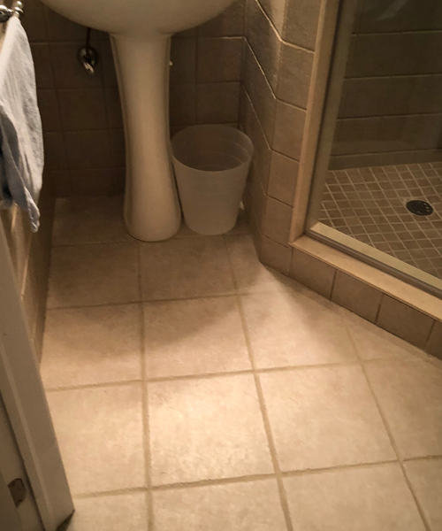 Before photo of a bathroom floor