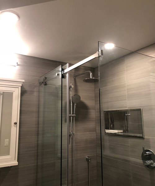 Shower area covered with glass paneling
