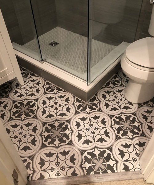 Newly renovated bathroom with a gorgeous flooring pattern